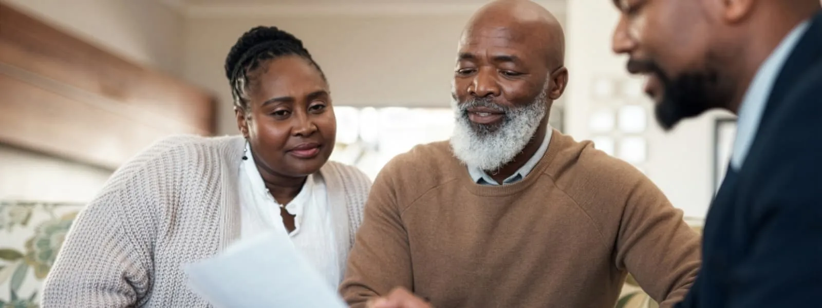 Image of a couple reviews their whole life insurance cash value with their agent