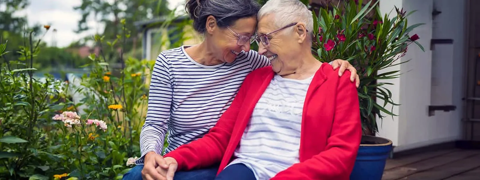 mother and adult daughter hugging
