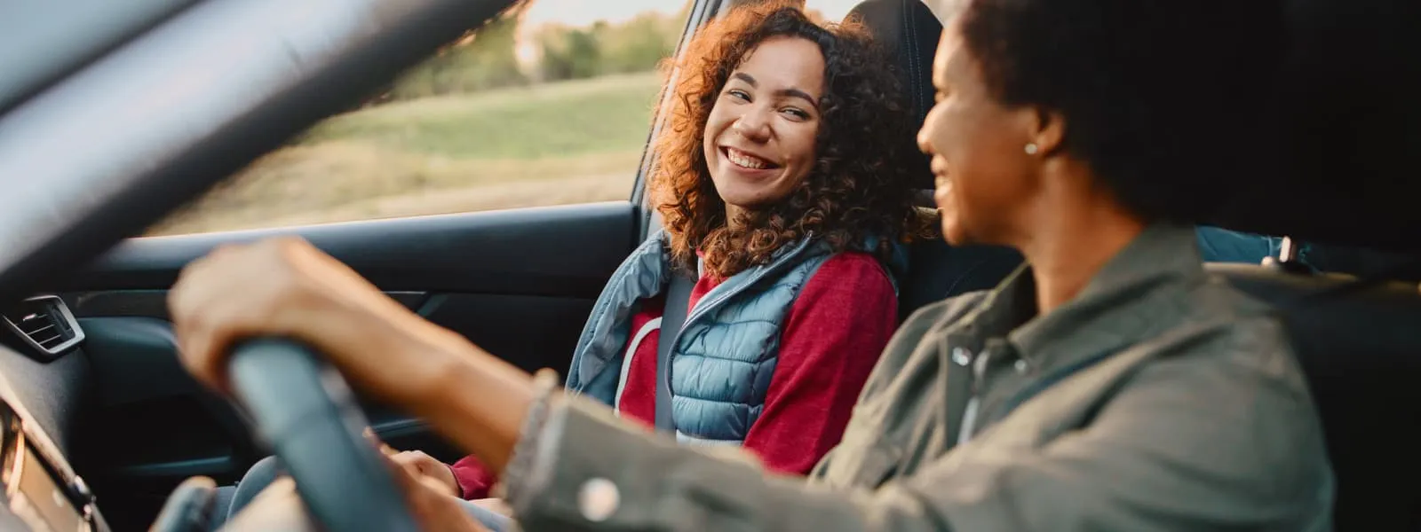 A woman driving with her daughter. Despite advances in driving safety features, motor vehicle accidents remain the leading cause of accidental death for people ages 8 to 34 years.
