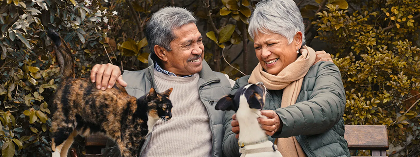 couple outside with pets