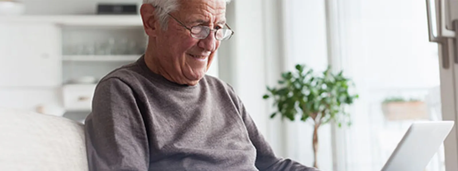 Senior man working on a computer.