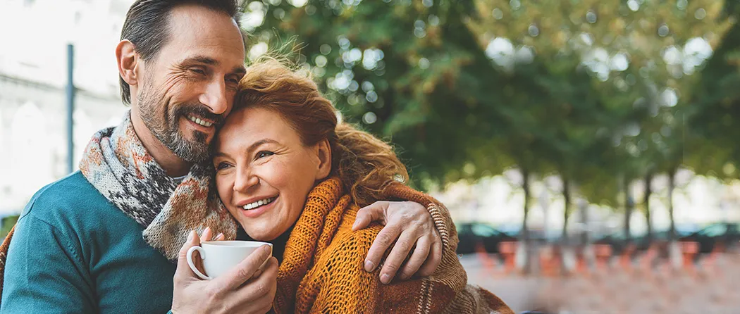 Image of a couple sitting and enjoying a cup of coffee