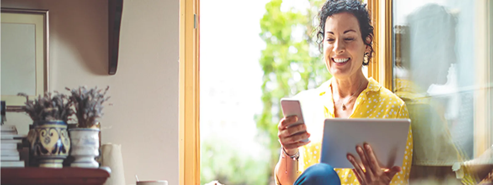 Senior woman on her phone and tablet.