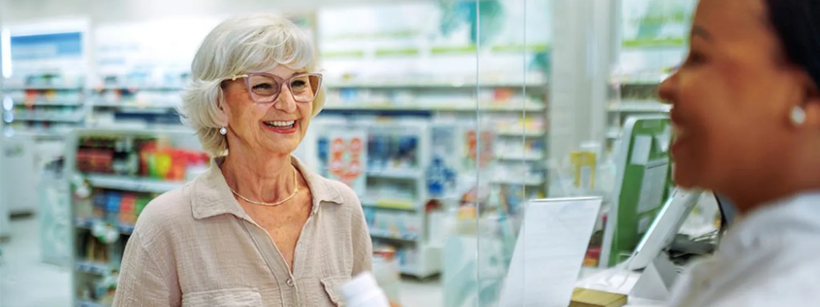 woman picking up prescription