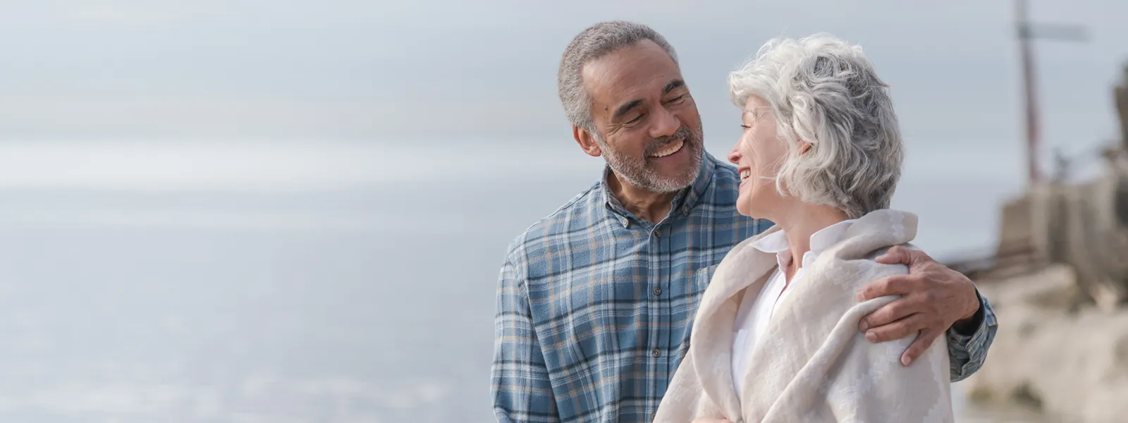 Smiling senior couple on the beach