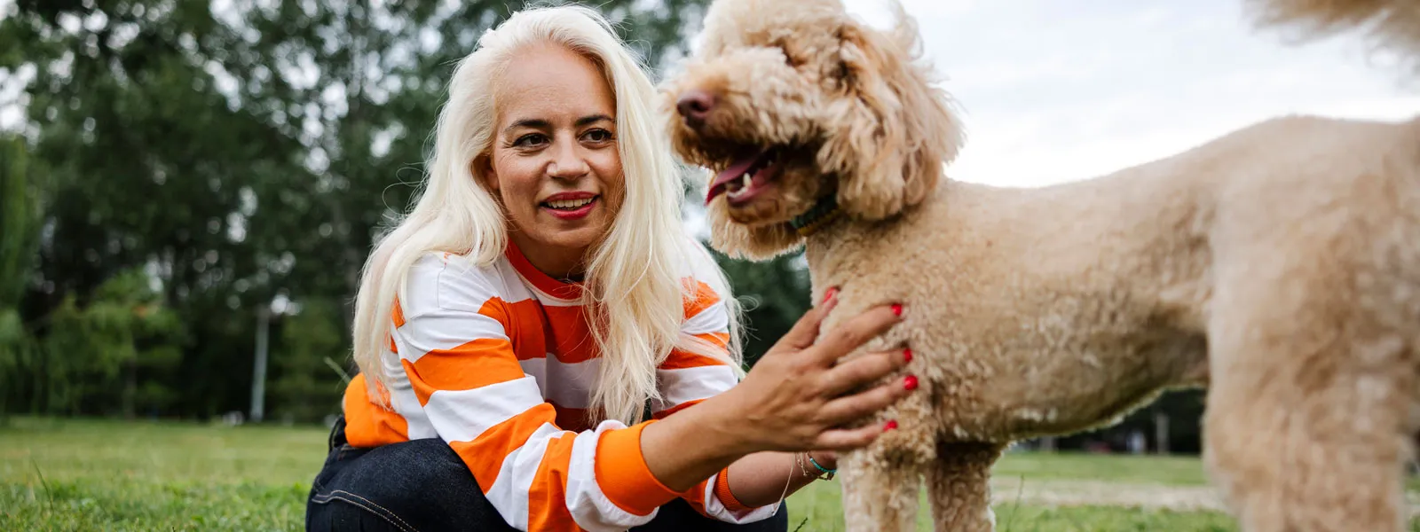 senior woman with poodle