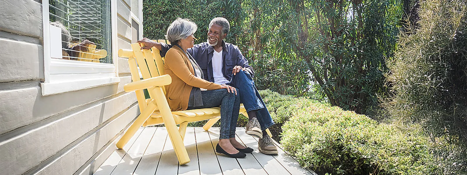 couple laughing on bench