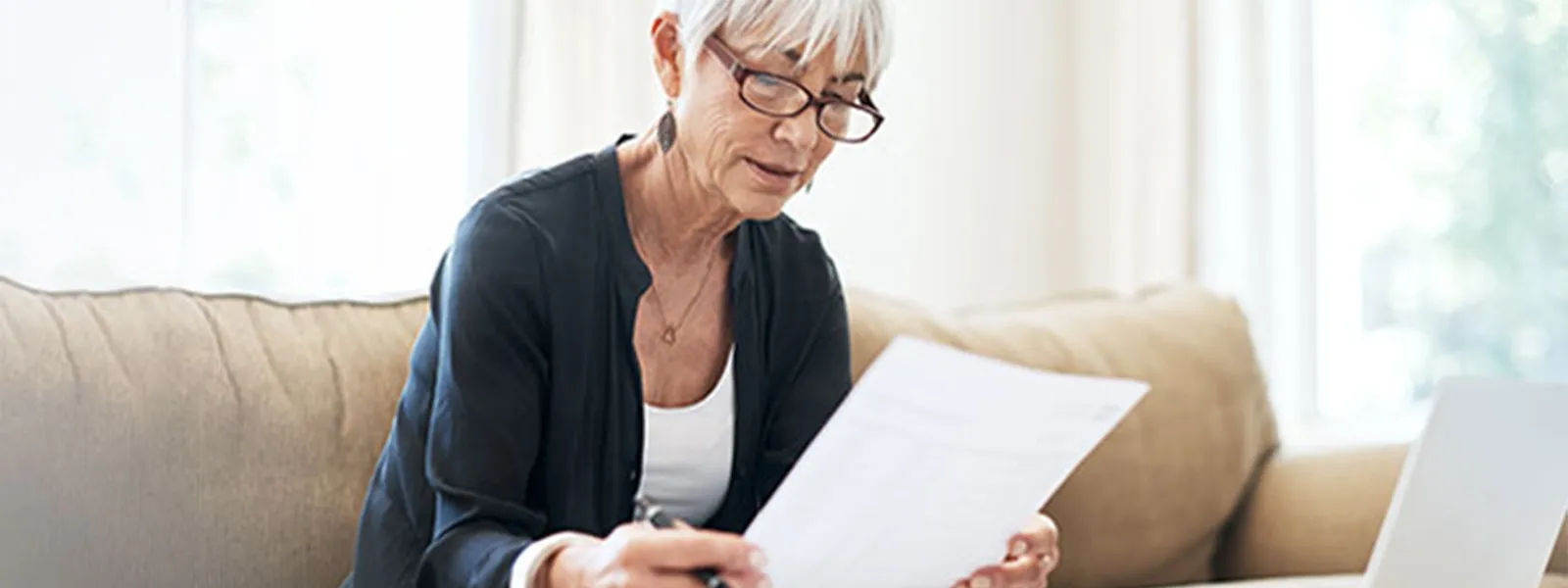Senior woman reviewing a document.