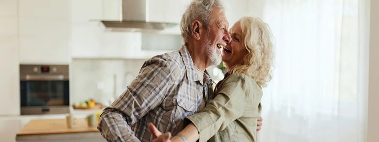 Couple dancing in kitchen
