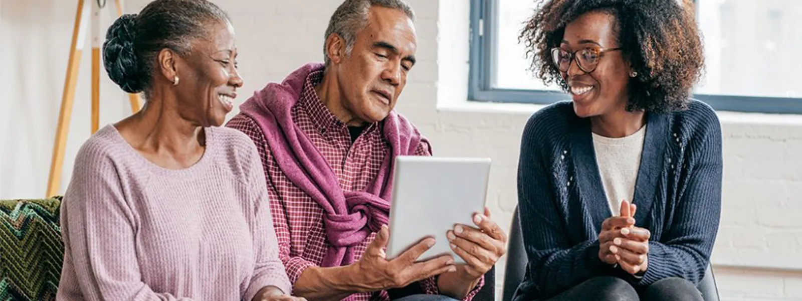 Senior couple consulting with an advisor.