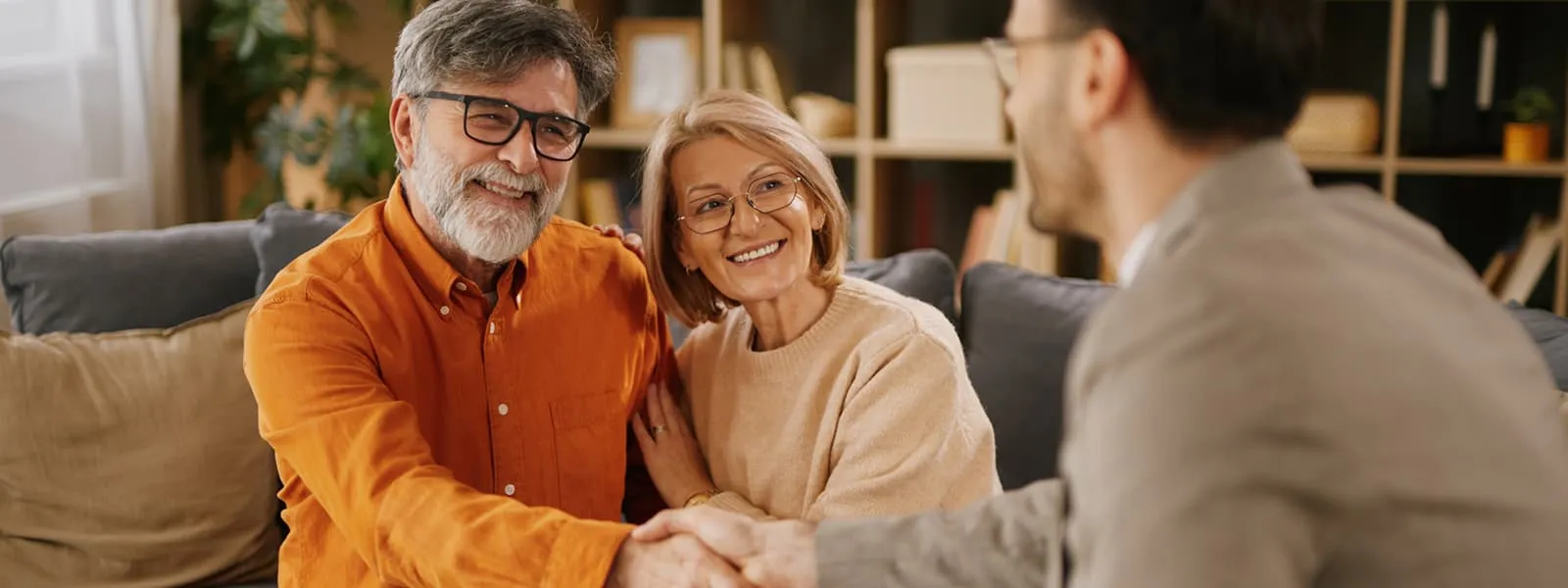 Couple speaking with financial advisor