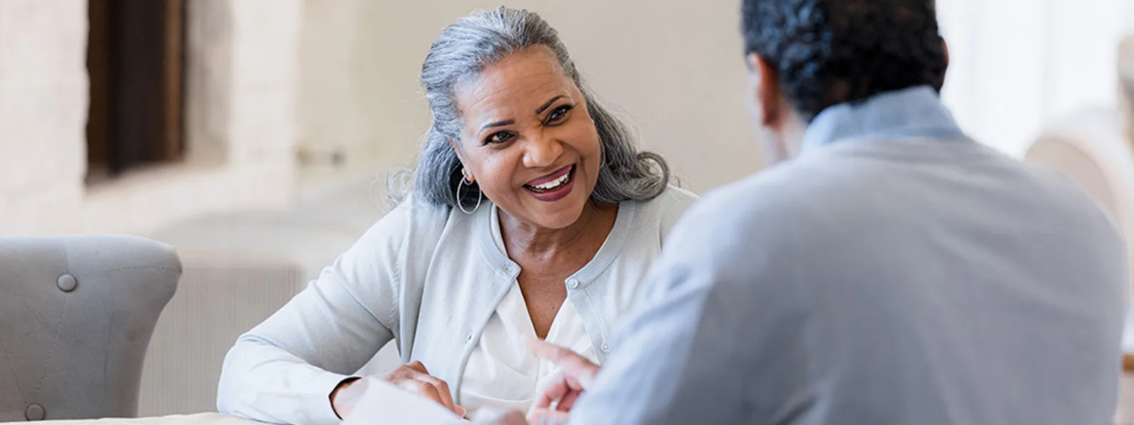woman chatting and smiling with man