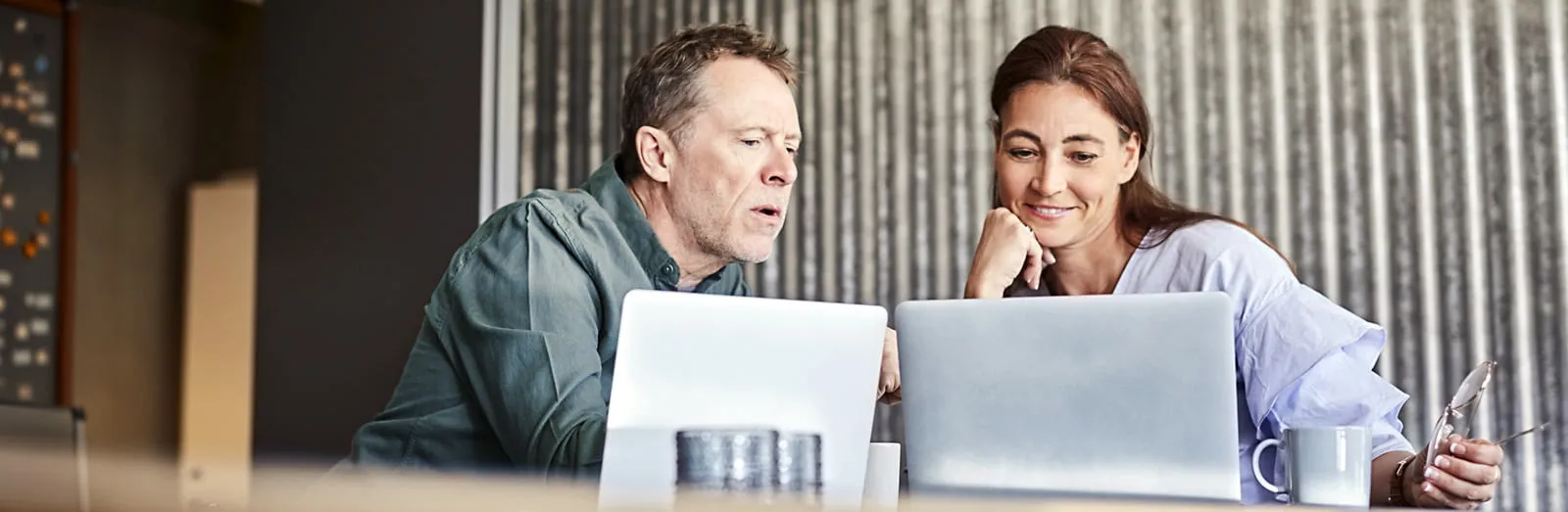 Coworkers looking at computer
