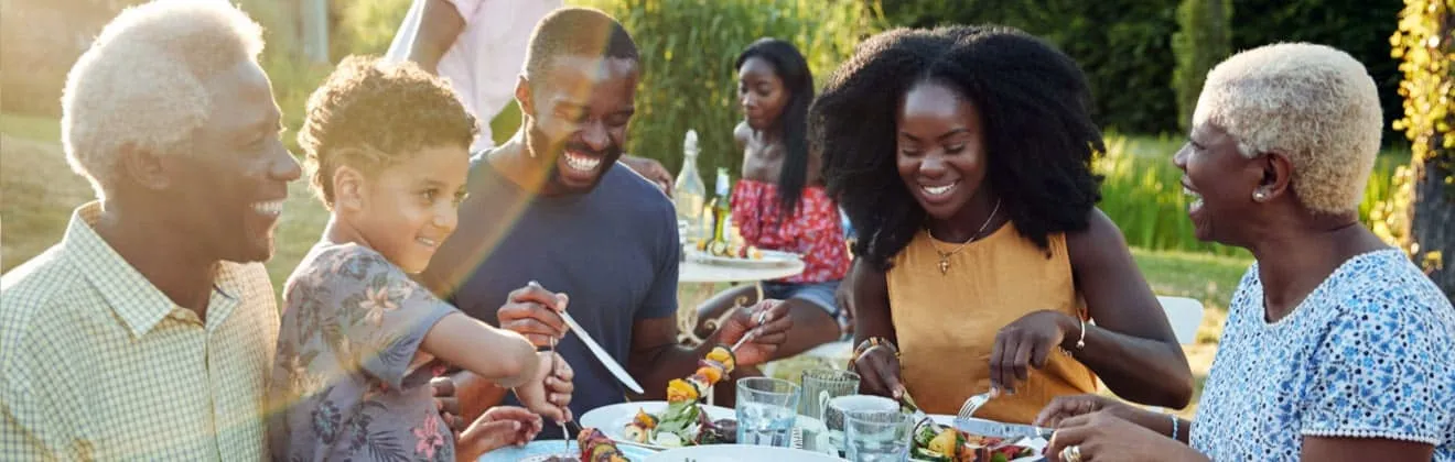Family sitting around a table eating