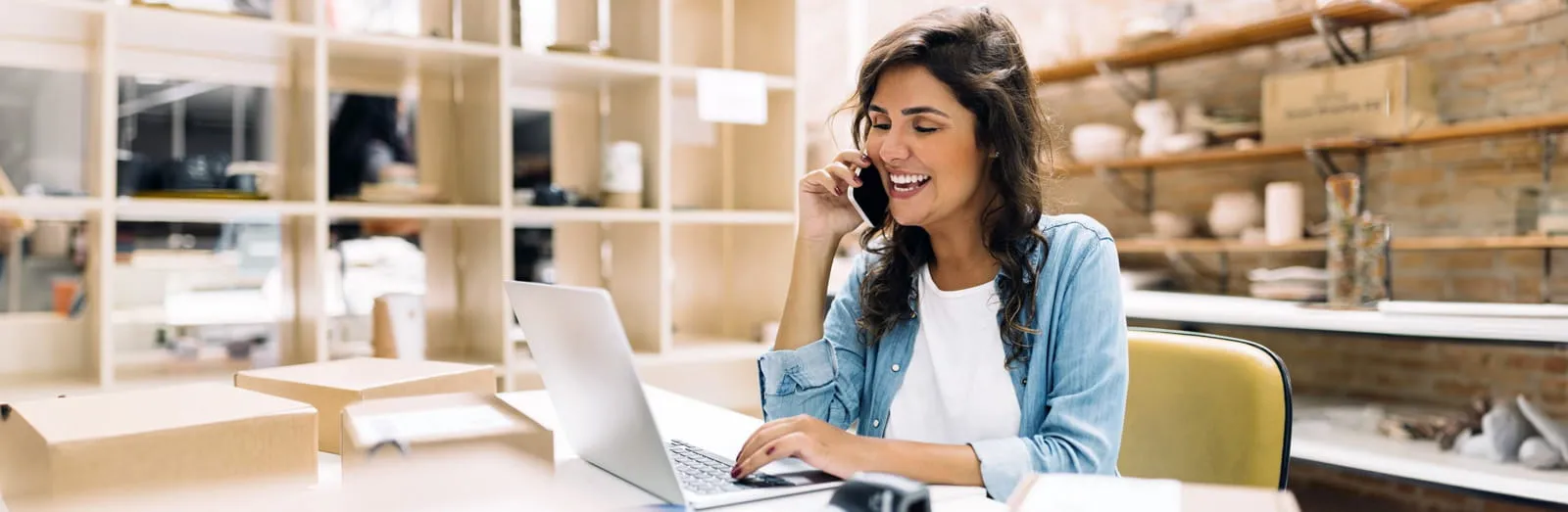 picture of two women talking in the office