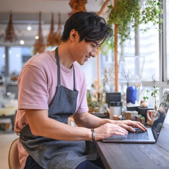 man using laptop at desk