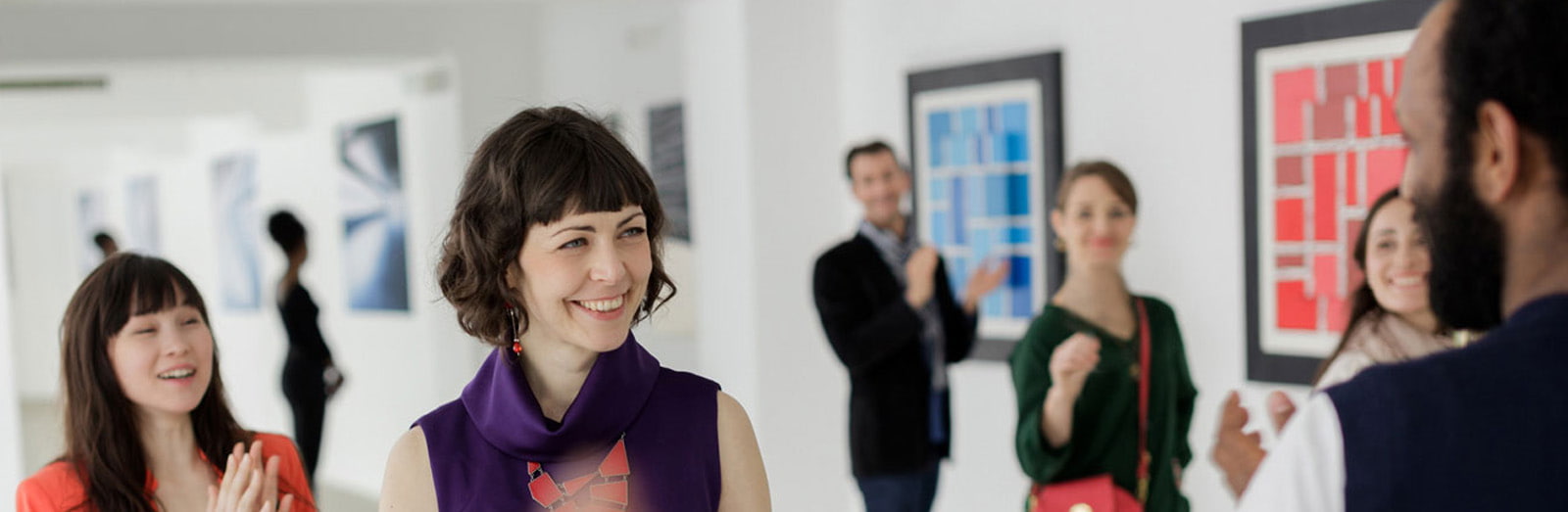 Reception with artists looking at each other