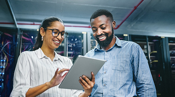 co-workers looking at tablet together