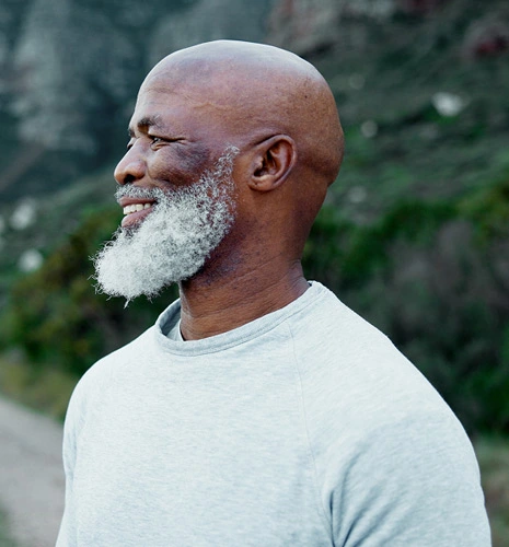 Smiling senior in a meditation pose