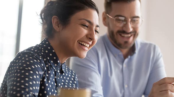 man and woman laughing together