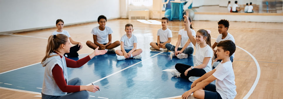 Kids in community gym with a coach