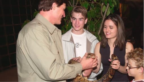 Peter Gros and Kids Holding Snake Image