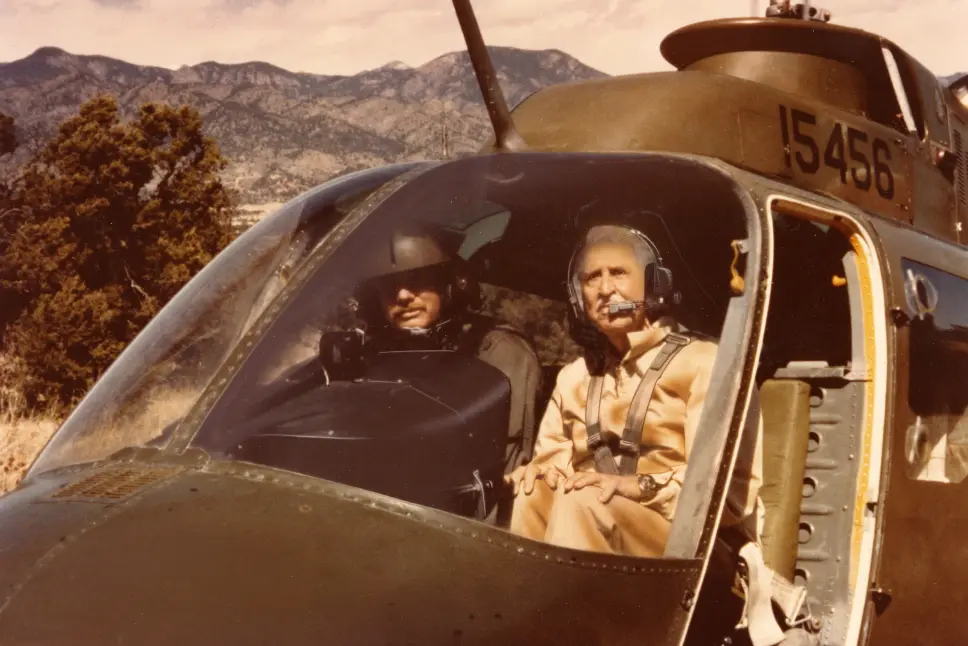 Marlin Perkins boards a helicopter while filming Wild Kingdom