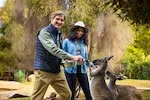 Thumbnail - Peter Gros and Dr. Rae Wynn-Grant feed kangaroos at the Santa Barbara Zoo