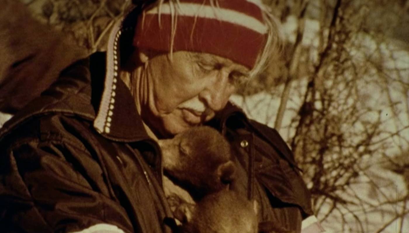 Marlin Perkins comforting a baby bear.