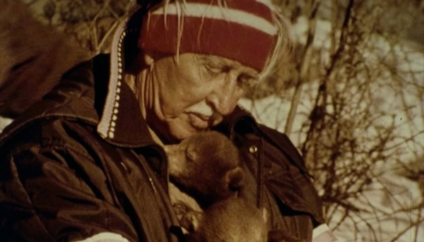Marlin Perkins comforting a baby bear.
